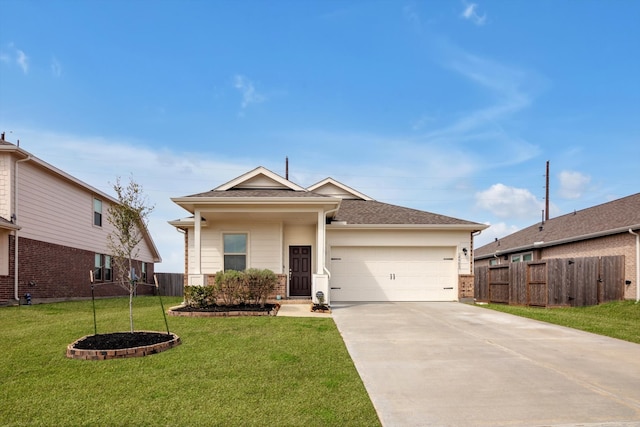 view of front of home featuring a garage, a front yard, driveway, and fence