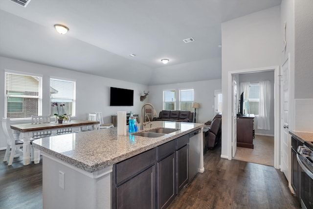 kitchen featuring open floor plan, appliances with stainless steel finishes, a sink, and visible vents