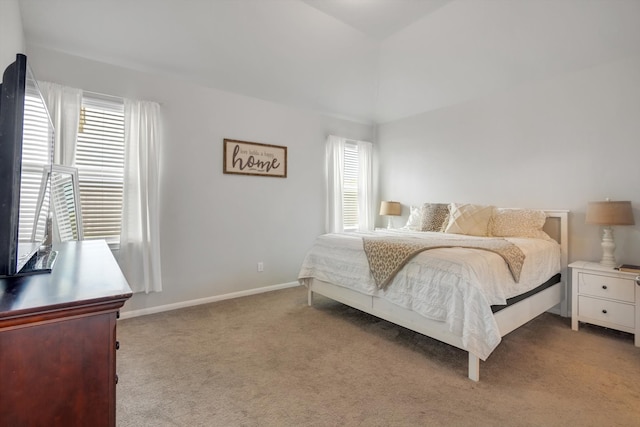 bedroom with carpet and baseboards