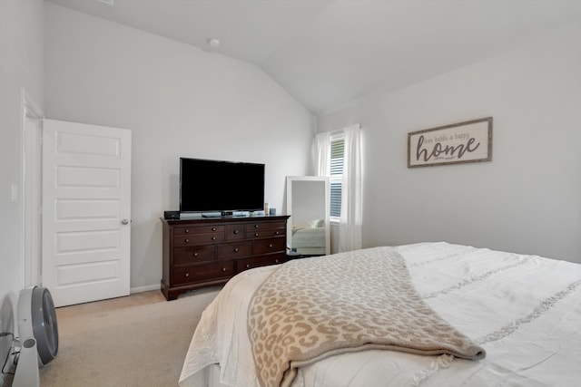 bedroom featuring lofted ceiling, carpet, and baseboards