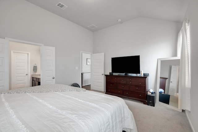 carpeted bedroom with high vaulted ceiling and visible vents