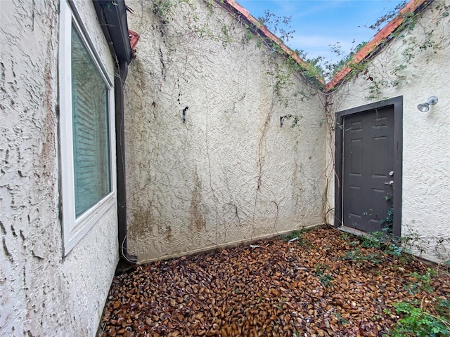 view of side of property with stucco siding