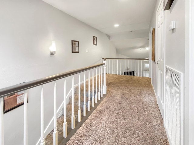 hallway with visible vents and carpet flooring