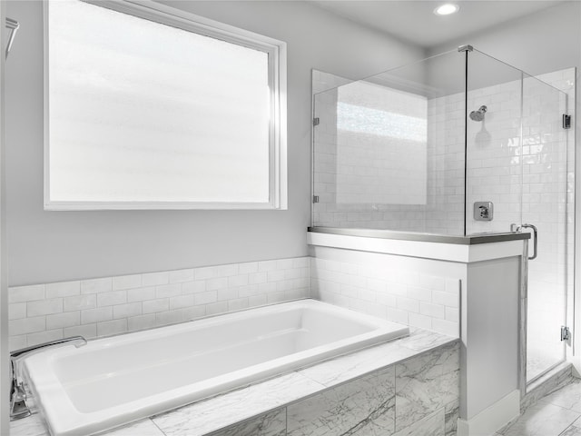 full bathroom featuring a garden tub, a shower stall, and recessed lighting