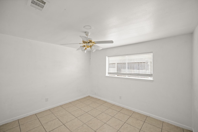 unfurnished room with ceiling fan, visible vents, and baseboards