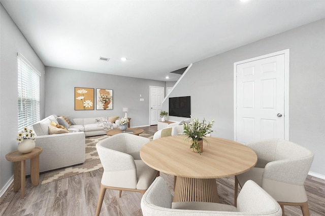 interior space featuring recessed lighting, visible vents, baseboards, and wood finished floors