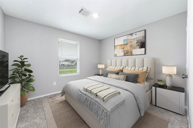 bedroom featuring visible vents and baseboards