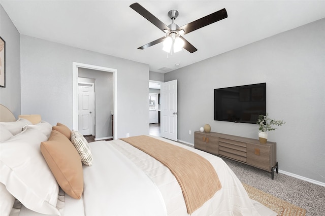 bedroom featuring carpet floors, baseboards, and a ceiling fan