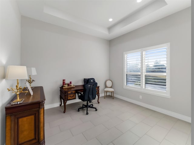 home office with recessed lighting, a raised ceiling, and baseboards