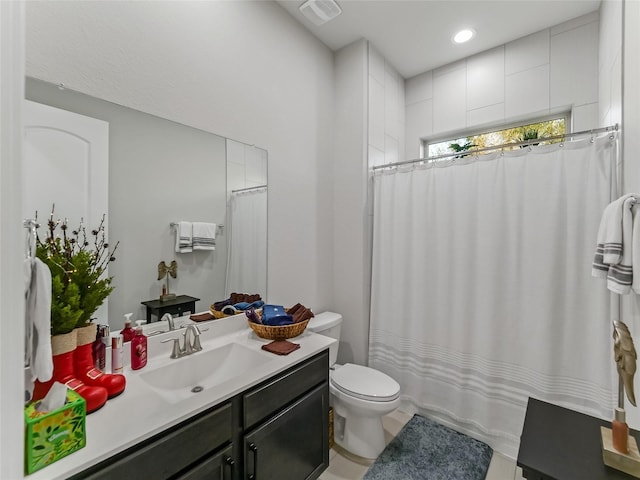 full bathroom with a shower with curtain, visible vents, vanity, and toilet