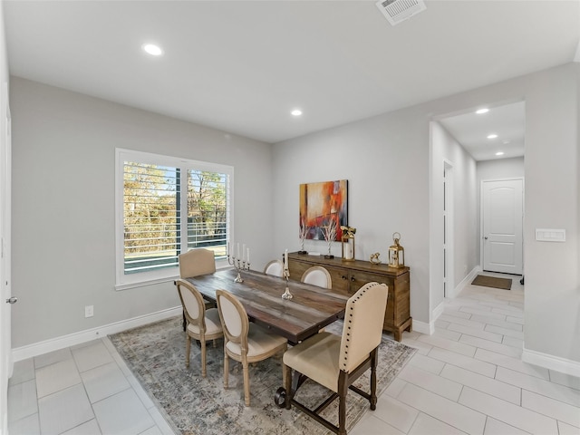 dining space with baseboards, light tile patterned flooring, visible vents, and recessed lighting