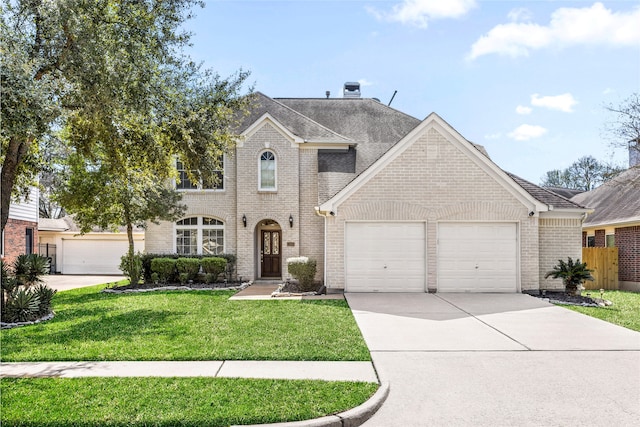 view of front of home featuring brick siding, an attached garage, a front yard, fence, and driveway