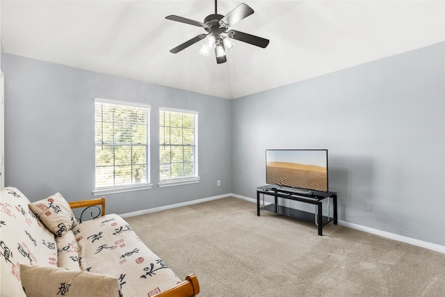 sitting room featuring ceiling fan, carpet flooring, and baseboards