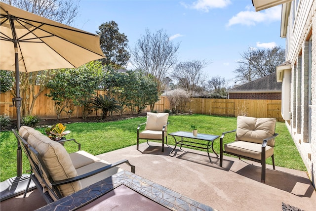 view of patio with a fenced backyard and outdoor lounge area