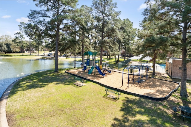 community play area with a yard and a water view