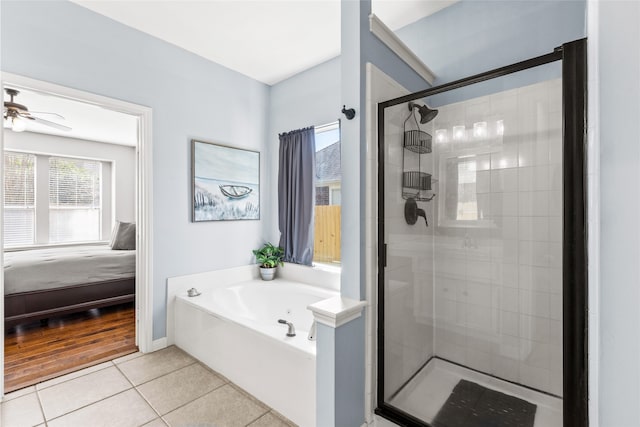 full bath featuring a garden tub, ensuite bathroom, a ceiling fan, a stall shower, and tile patterned floors