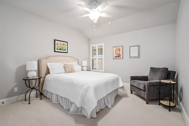 bedroom featuring lofted ceiling, baseboards, a ceiling fan, and light colored carpet