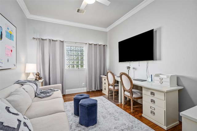 living room with crown molding, visible vents, and dark wood finished floors