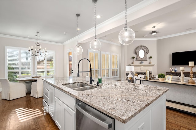 kitchen featuring open floor plan, dark wood-type flooring, stainless steel dishwasher, a fireplace, and a sink