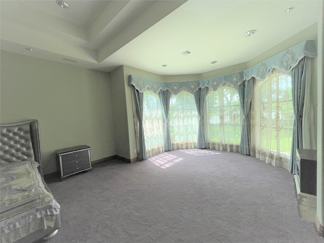 unfurnished bedroom with visible vents and carpet flooring