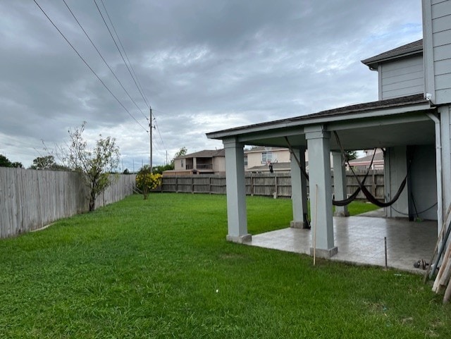 view of yard with a patio area and a fenced backyard