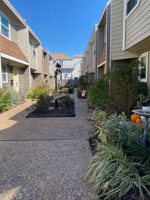 view of property's community featuring a residential view and a patio