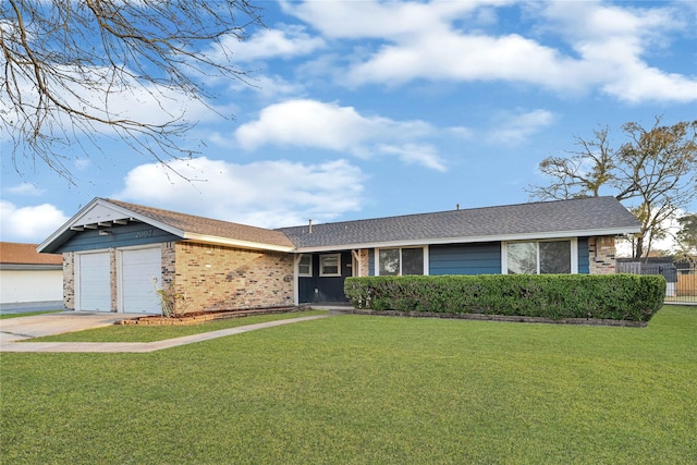 ranch-style home featuring an attached garage, brick siding, a shingled roof, concrete driveway, and a front lawn