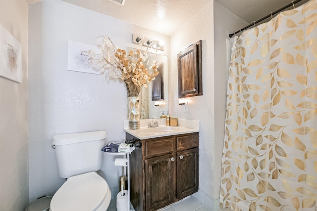 bathroom featuring a shower with curtain, a textured wall, vanity, and toilet