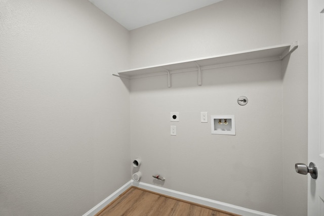 washroom with laundry area, hookup for a gas dryer, wood finished floors, hookup for a washing machine, and electric dryer hookup