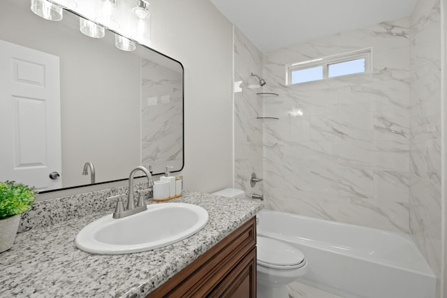 full bathroom featuring toilet, tub / shower combination, and vanity