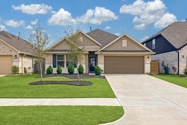 view of front of property with a garage, concrete driveway, roof with shingles, a front lawn, and board and batten siding