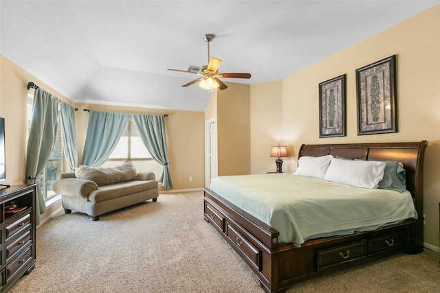 carpeted bedroom featuring lofted ceiling, a ceiling fan, and baseboards