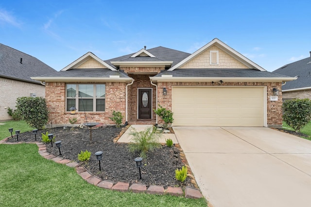 view of front of property featuring a garage, concrete driveway, brick siding, and roof with shingles