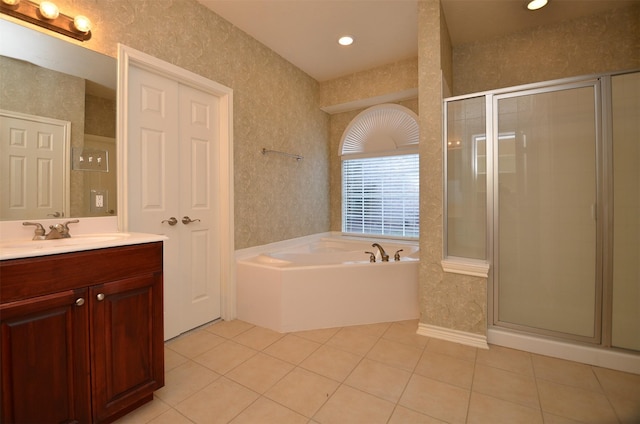 full bath with wallpapered walls, a stall shower, and tile patterned flooring