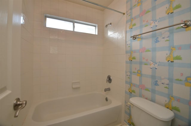 full bath featuring toilet,  shower combination, and wallpapered walls