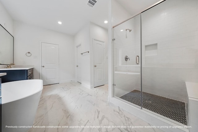 full bathroom with a stall shower, visible vents, marble finish floor, vanity, and a freestanding tub