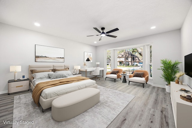 bedroom featuring light wood-style floors, recessed lighting, and baseboards