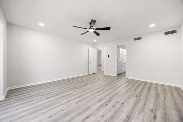 unfurnished room with recessed lighting, visible vents, and light wood-style flooring