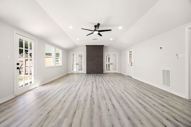 unfurnished living room featuring baseboards, visible vents, lofted ceiling, french doors, and light wood-style floors