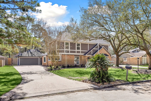 tudor house with a garage, concrete driveway, fence, a front lawn, and brick siding