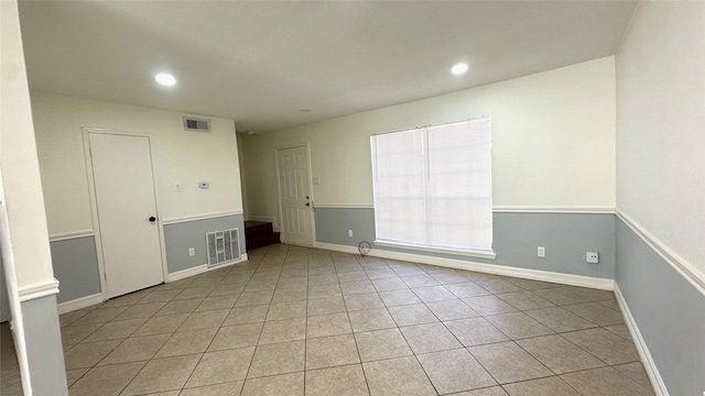 spare room with light tile patterned floors, visible vents, and recessed lighting