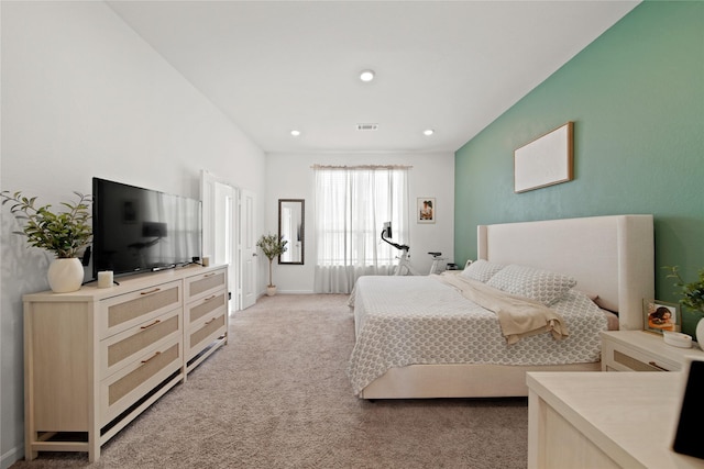 bedroom featuring recessed lighting, light colored carpet, and visible vents