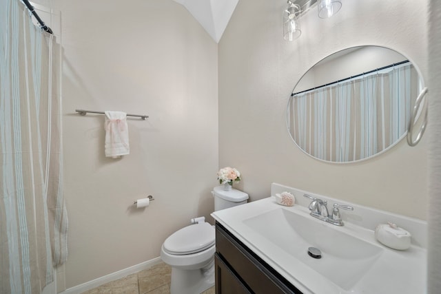 bathroom featuring a shower with shower curtain, toilet, vanity, tile patterned flooring, and baseboards