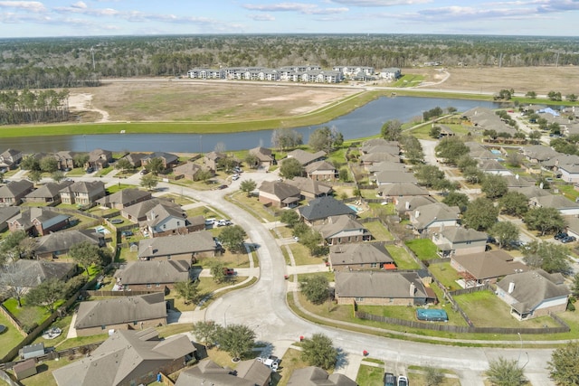 bird's eye view featuring a water view and a residential view