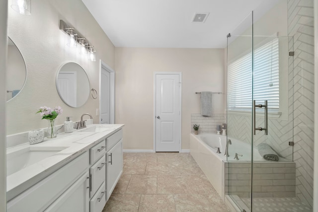 bathroom featuring double vanity, visible vents, a sink, a shower stall, and a bath