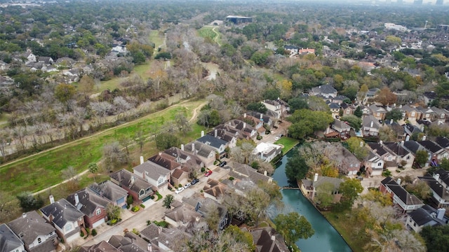 birds eye view of property featuring a water view and a residential view