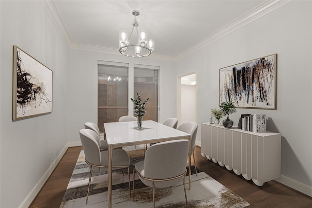 dining space featuring a chandelier, dark wood finished floors, and baseboards