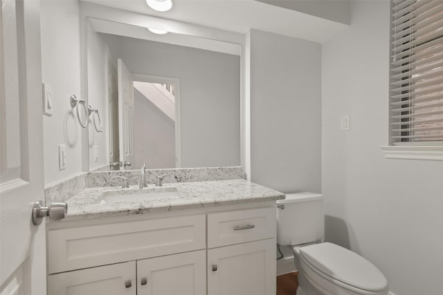 half bath with toilet and vanity