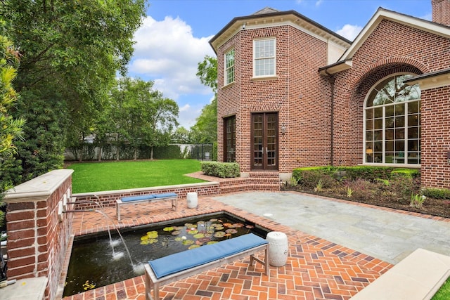 view of patio with fence and a swimming pool