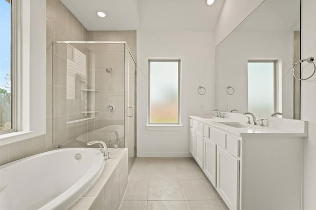 4918 Shore Arbor Ln, Katy, TX 77493 - full bathroom with a bath, a stall shower, double vanity, tile patterned flooring, and baseboards